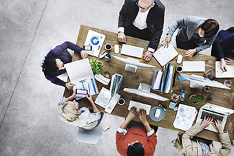 People at a large desk