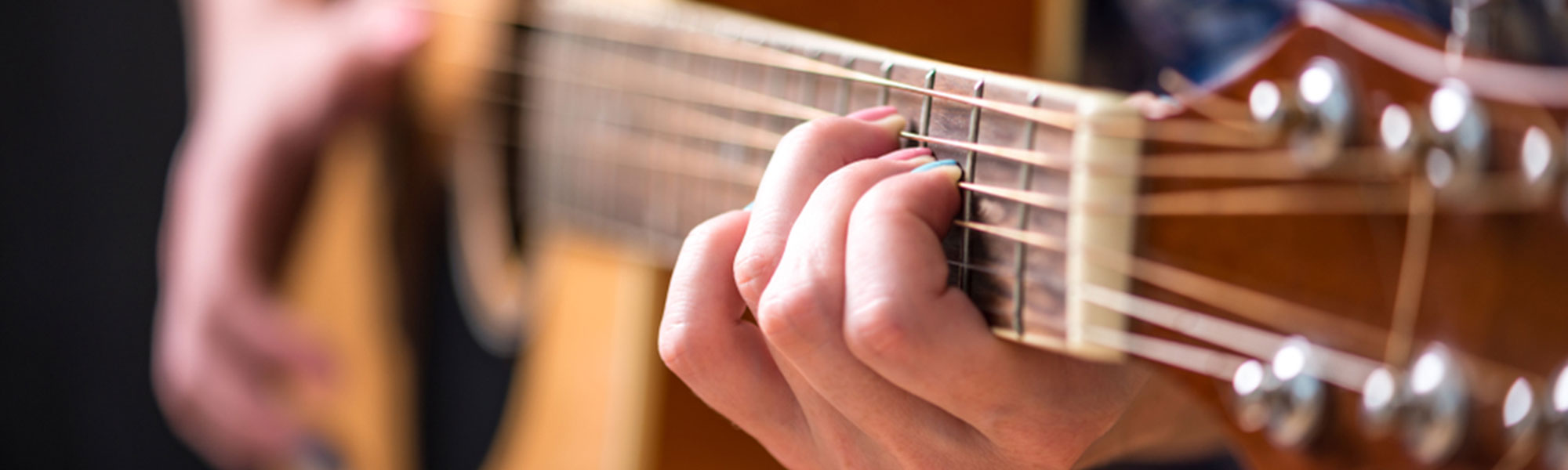 A person playing the guitar