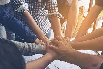 A group of people's hands to show collaboration