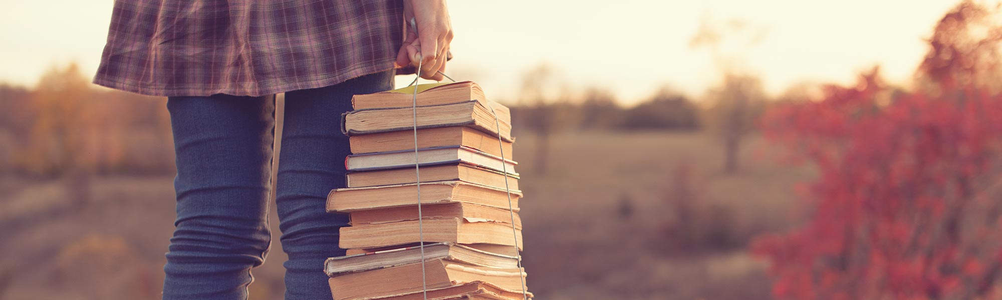 A person holding some books