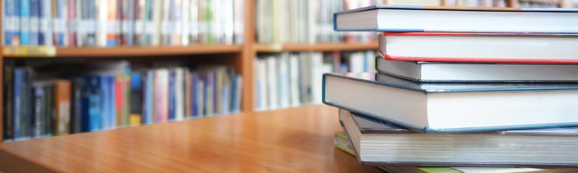 Library setting and some books on a table