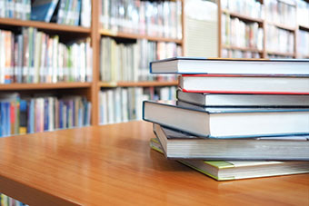 Library setting and some books on a table