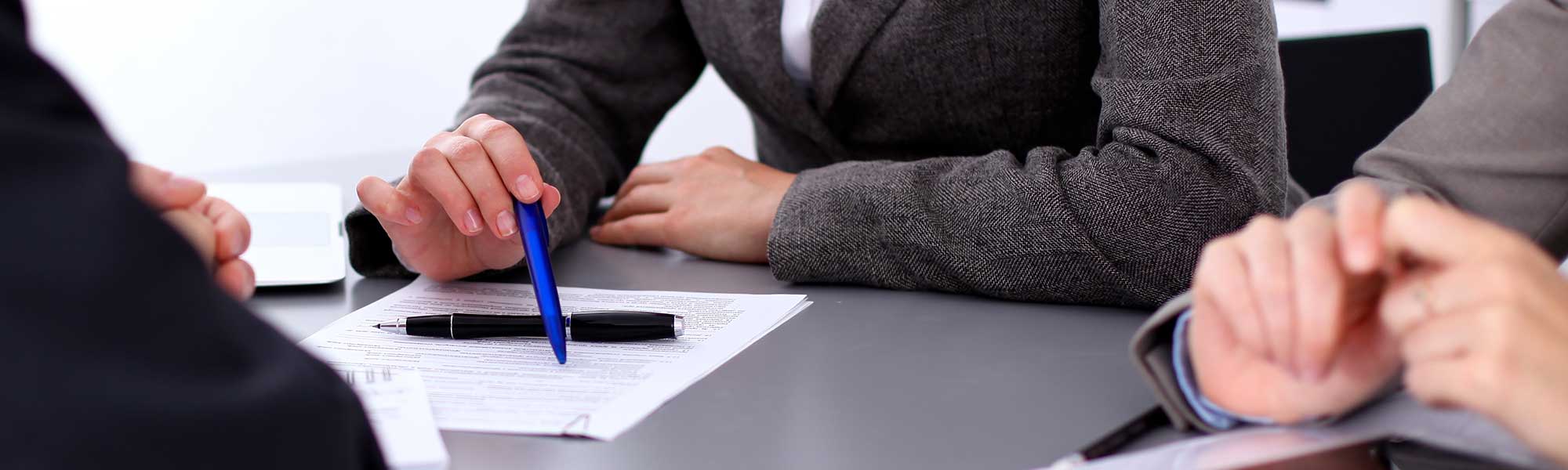 People pointing at a document